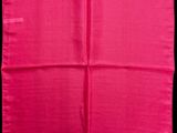 a pink silk pocket square on a black background