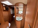 a bathroom with a sink and a mirror on the wall