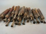 a pile of old baseball bats on a table
