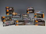 a group of six diecast cars in a display case