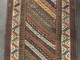 a rug with a geometric design on a grey ground