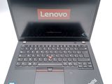 a laptop with a lenovo logo on the screen