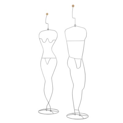 un dessin représentant deux mannequins posés sur un socle