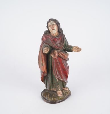 figurine of a man with a red robe and a red robe