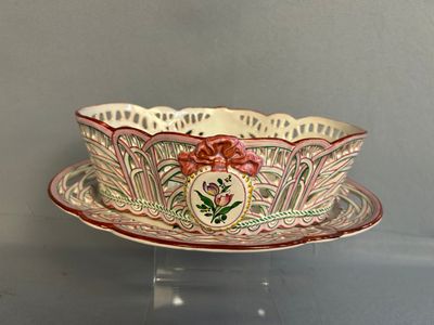 a bowl and saucer sitting on a clear table
