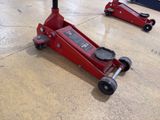 two red jacks that are sitting on the floor