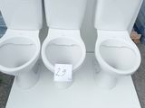 three toilets that are on display in a store