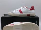 men ' s white and red sneakers with a red stripe on the sole