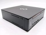 an image of a small black computer on a white surface