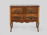 an antique chest of drawers with marble top