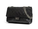 black quilted leather shoulder bag with chain strap