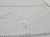 a white table cloth with a picture of a man and a woman on it