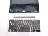 a laptop computer sitting on top of a white table