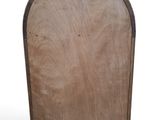an image of a wooden plaque with a curved top