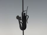 an image of a black and gold candle holder with a bird on it