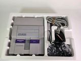a nintendo game console in a white box with wires