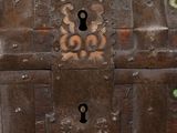 an old wooden chest with a keyhole on it
