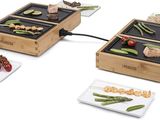 three wooden trays with different types of food on them