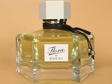 a close up of a bottle of perfume sitting on a table