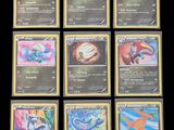 the pokemon cards are lined up on a black surface