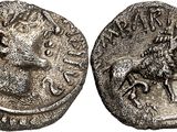 a silver coin with an image of a lion on it