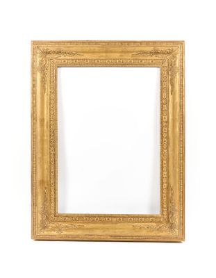 a gold frame on a white wall with a white background