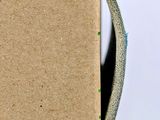 a cardboard box with a smiley face drawn on it