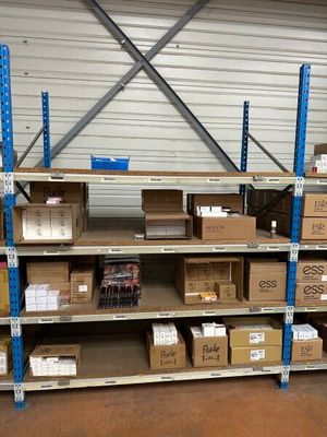many boxes and boxes on the shelves in the warehouse