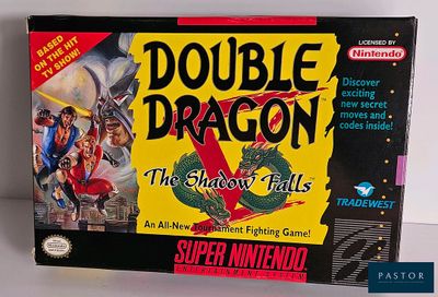 La boîte du jeu Double Dragon est posée sur la table.