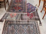 several rugs are laid out on the floor in a room
