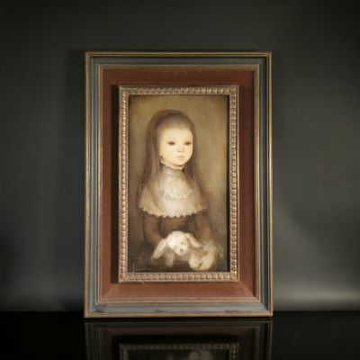 portrait of a young girl with a rabbit in a wooden frame