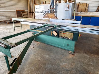 a picture of a table sawing machine in a workshop