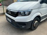 a picture of a white van parked on the side of the road