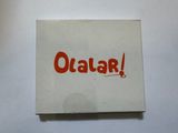 a white box with orange writing on it that says qatar