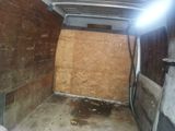 an image of a small room with a wooden wall