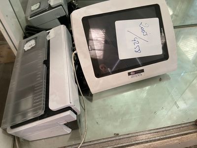 two microwaves and a toaster sitting on a counter