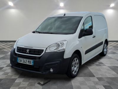 the white van is parked in a large room with a checkered floor