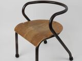 an image of a wooden chair with black legs and a wooden seat
