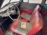 a red and black seat in the back of a car