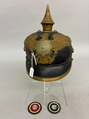 a helmet with a gold decoration on the top of it