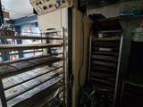 an image of a kitchen with a rack of food