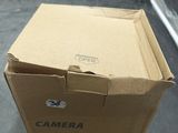 a box that has a camera inside of it on a table