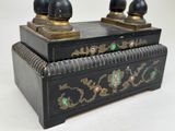 a black box with two black knobs on top of it