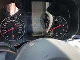 a close up of a car dashboard with a speedometer and gauges