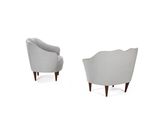 a pair of grey chairs sitting next to each other on a white surface