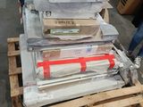 a stack of boxes and boxes on a pallet in a warehouse