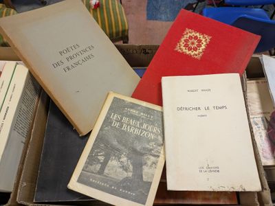 several books are stacked on top of each other on a table