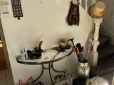 a pile of stuff on the floor next to the stairs
