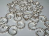 a lot of silver rings that are on a table