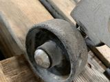 a close up of a piece of wood with a machine on it
